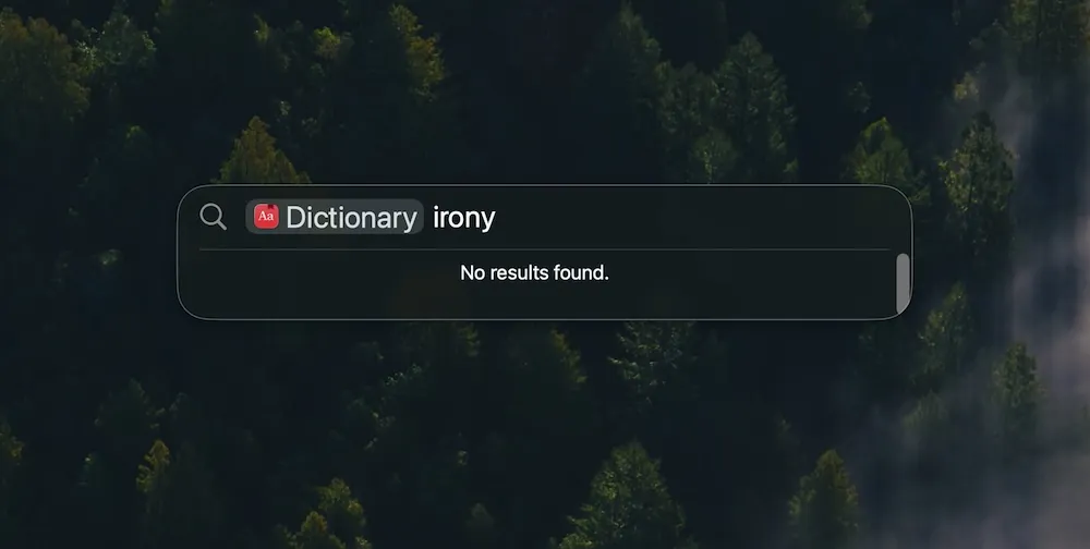 &ldquo;Screenshot of macOS Tahoe Spotlight&rdquo;